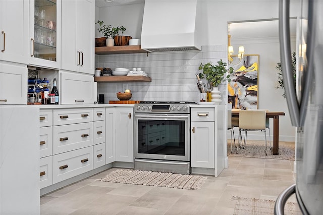 9067 Cypress Trl, Seminole, FL 33777 - kitchen featuring custom exhaust hood, stainless steel appliances, white cabinets, and tasteful backsplash