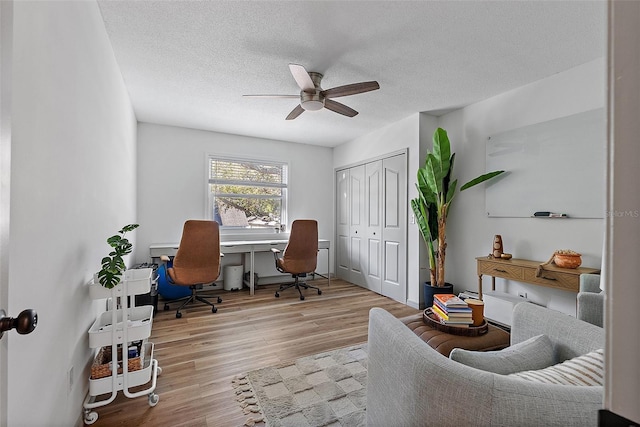 9067 Cypress Trl, Seminole, FL 33777 - office area featuring ceiling fan, wood finished floors, and a textured ceiling