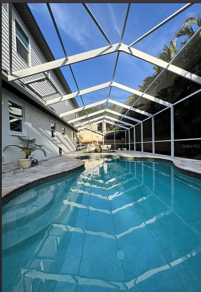 9067 Cypress Trl, Seminole, FL 33777 - outdoor pool with a patio and glass enclosure