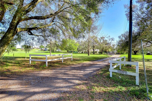 view of home's community featuring a yard