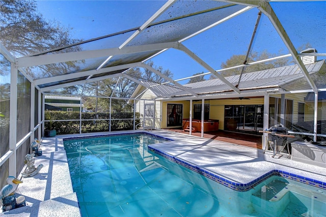 outdoor pool featuring a patio and a lanai