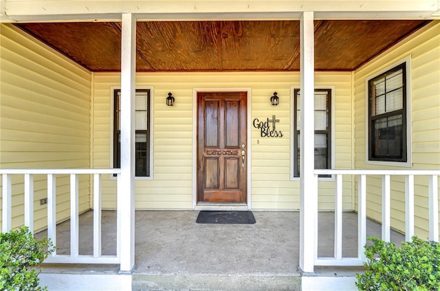 doorway to property with a porch