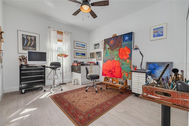 home office with ceiling fan, baseboards, and wood finished floors