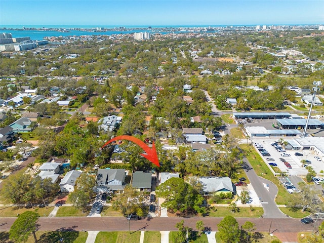 birds eye view of property with a residential view and a water view