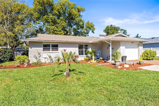 single story home with a garage, stucco siding, and a front lawn