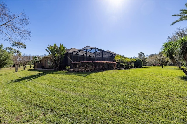 view of yard featuring glass enclosure