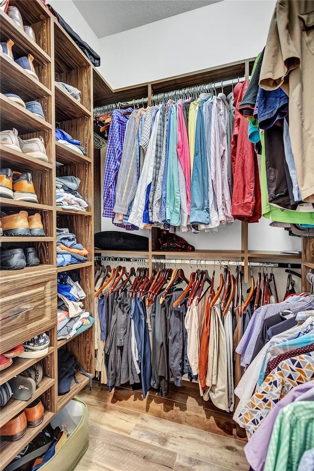 spacious closet with wood finished floors