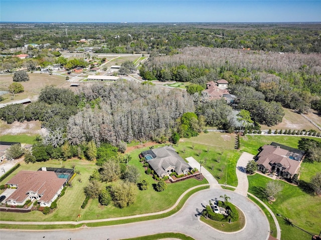 drone / aerial view featuring a view of trees