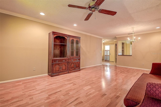 living room with light wood-style floors, baseboards, and a textured ceiling