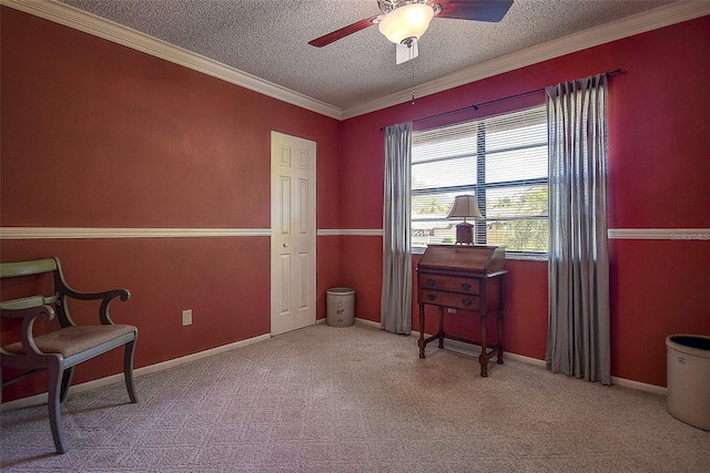 living area with a ceiling fan, baseboards, ornamental molding, a textured ceiling, and carpet flooring