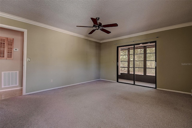 carpeted spare room featuring visible vents, baseboards, ornamental molding, a textured ceiling, and a ceiling fan