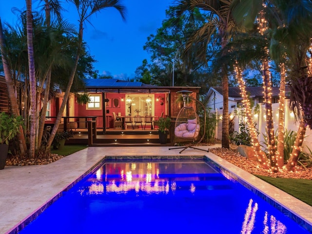 pool featuring a deck and fence