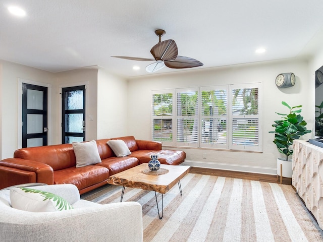 living room featuring recessed lighting, baseboards, light wood-style flooring, and ceiling fan