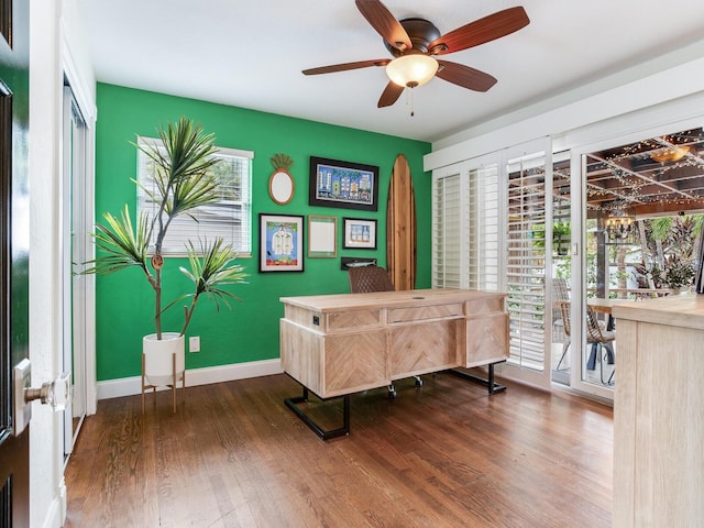 home office with ceiling fan, baseboards, and wood finished floors