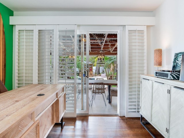 dining space with dark wood-style flooring