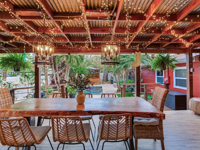 dining area with a notable chandelier and wood finished floors