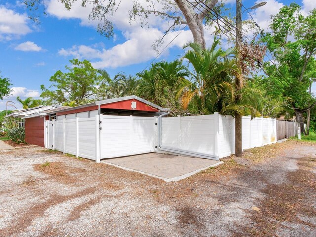 garage with fence