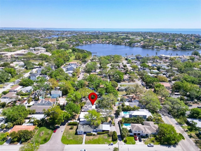 drone / aerial view featuring a residential view and a water view