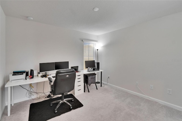 office space with baseboards and carpet floors