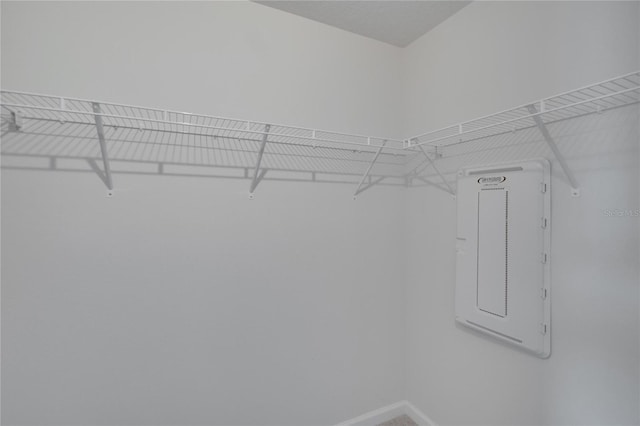 walk in closet featuring electric panel