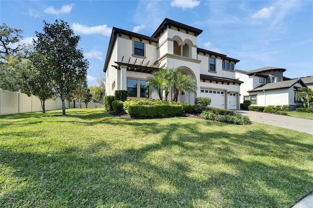 view of front of property with stucco siding, driveway, a front lawn, fence, and a garage