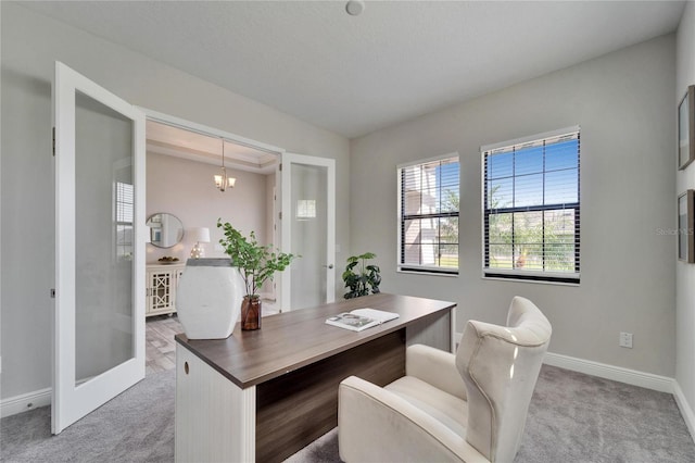 office with an inviting chandelier, light colored carpet, and baseboards