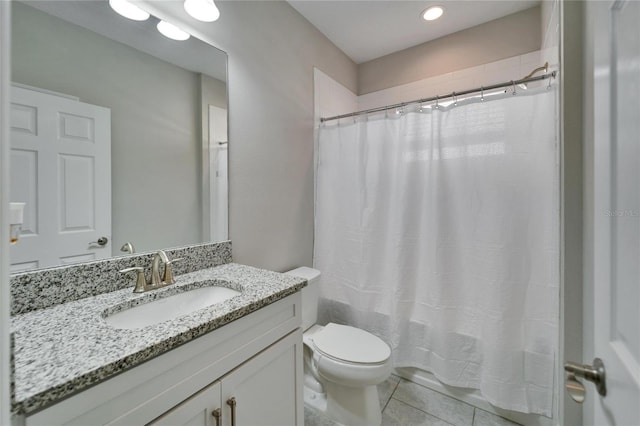 full bathroom with tile patterned floors, toilet, vanity, and shower / bathtub combination with curtain