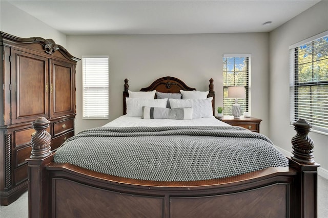 bedroom with baseboards and carpet floors