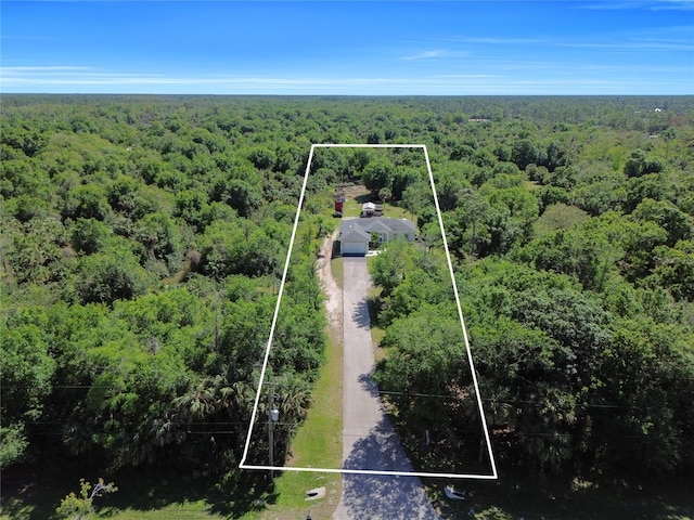 aerial view featuring a view of trees