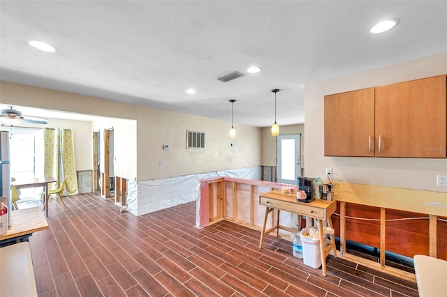 kitchen with wood finish floors, visible vents, and recessed lighting