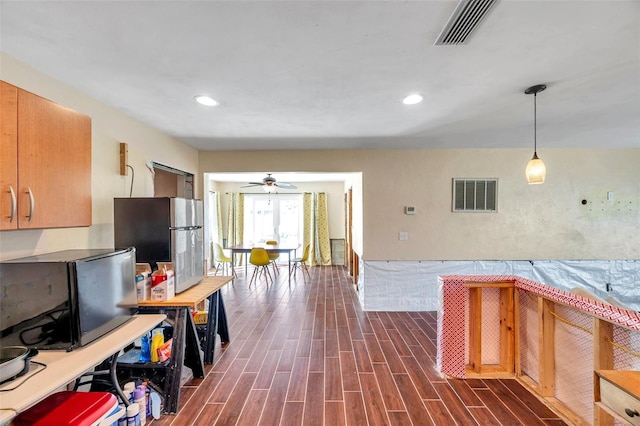 kitchen featuring freestanding refrigerator, recessed lighting, visible vents, and wood tiled floor