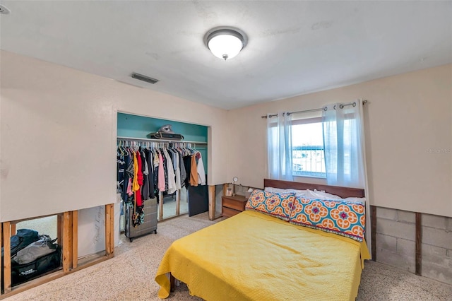 bedroom featuring visible vents and a closet