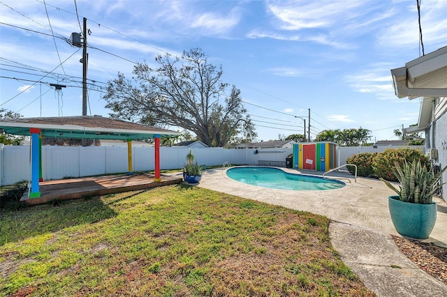 view of pool with a deck, a fenced backyard, a yard, a fenced in pool, and a patio area