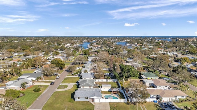 bird's eye view featuring a water view and a residential view