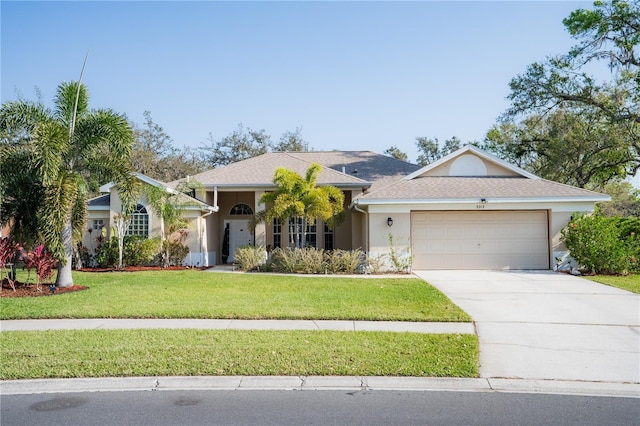 ranch-style house with stucco siding, a garage, concrete driveway, and a front yard