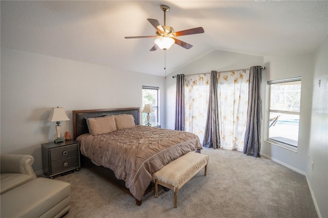 bedroom featuring carpet flooring, ceiling fan, baseboards, and vaulted ceiling