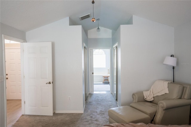 sitting room featuring vaulted ceiling, carpet, visible vents, and baseboards