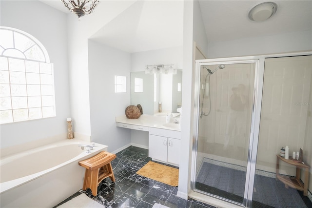 bathroom featuring a bath, a shower stall, vanity, and baseboards