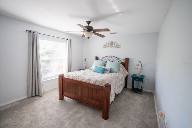 bedroom featuring visible vents, ceiling fan, carpet, and baseboards