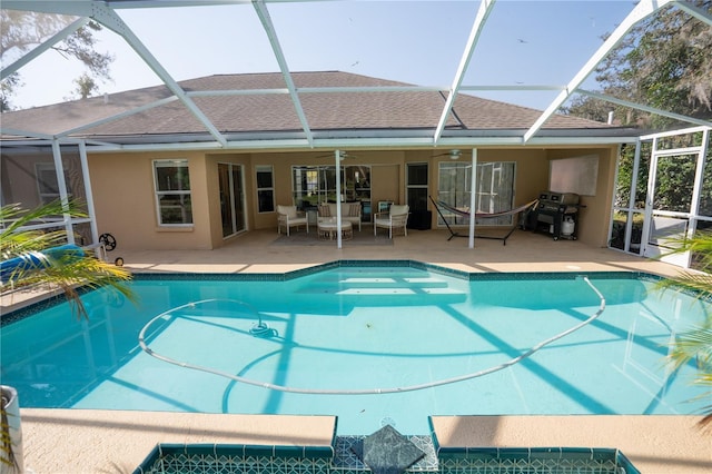 outdoor pool with a lanai, an outdoor hangout area, a patio, a grill, and a ceiling fan