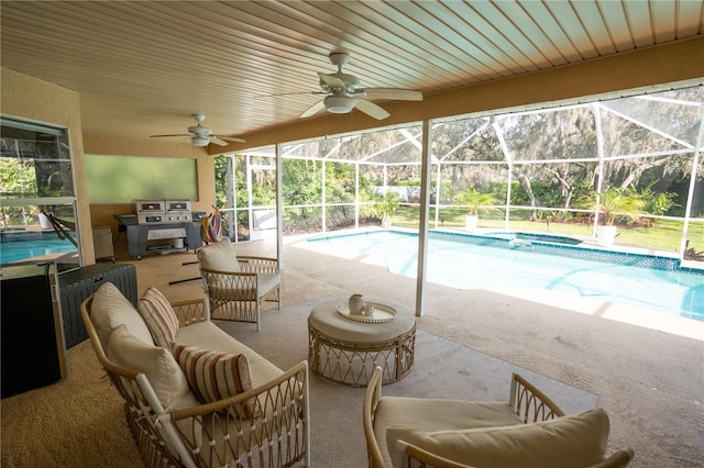 view of swimming pool with a patio area, grilling area, a lanai, and outdoor lounge area