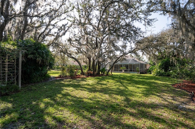 view of yard featuring a lanai