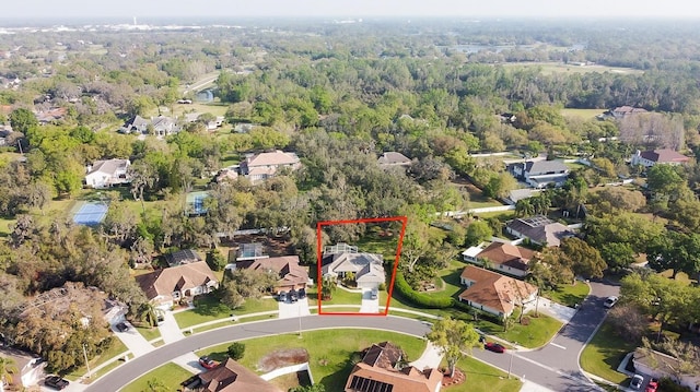 bird's eye view featuring a forest view and a residential view