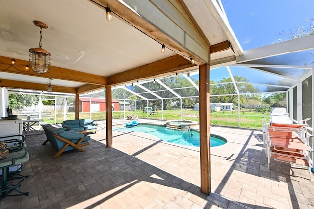 view of pool featuring a lanai, a pool with connected hot tub, fence, and a patio