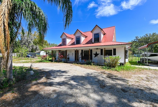 view of front of home with covered porch and metal roof