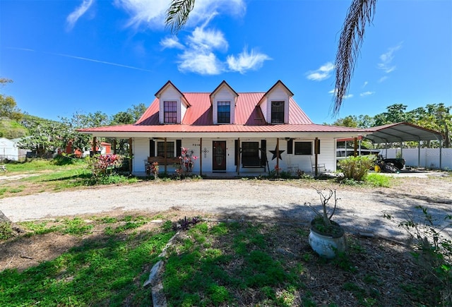 view of front of house featuring a porch and metal roof