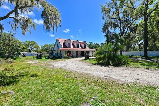 view of front of house featuring fence