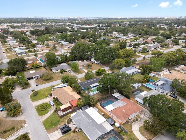 birds eye view of property with a residential view