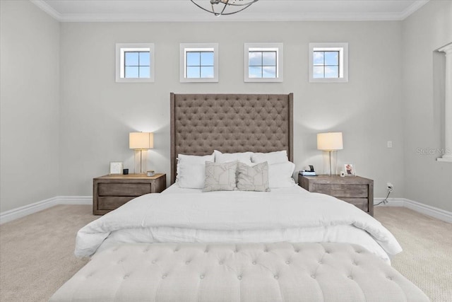 bedroom with baseboards, carpet, and crown molding