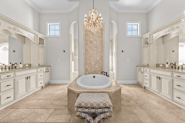 full bathroom with a sink, a towering ceiling, and ornamental molding